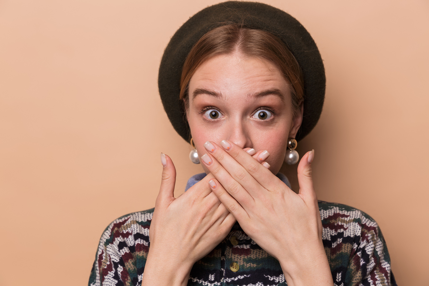 Photo of Excited Woman Expressing Surprise and Covering Her Mouth